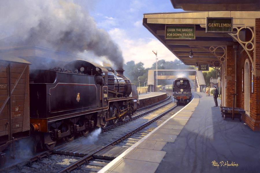 Trains pass at Crediton station in Devon. 1956